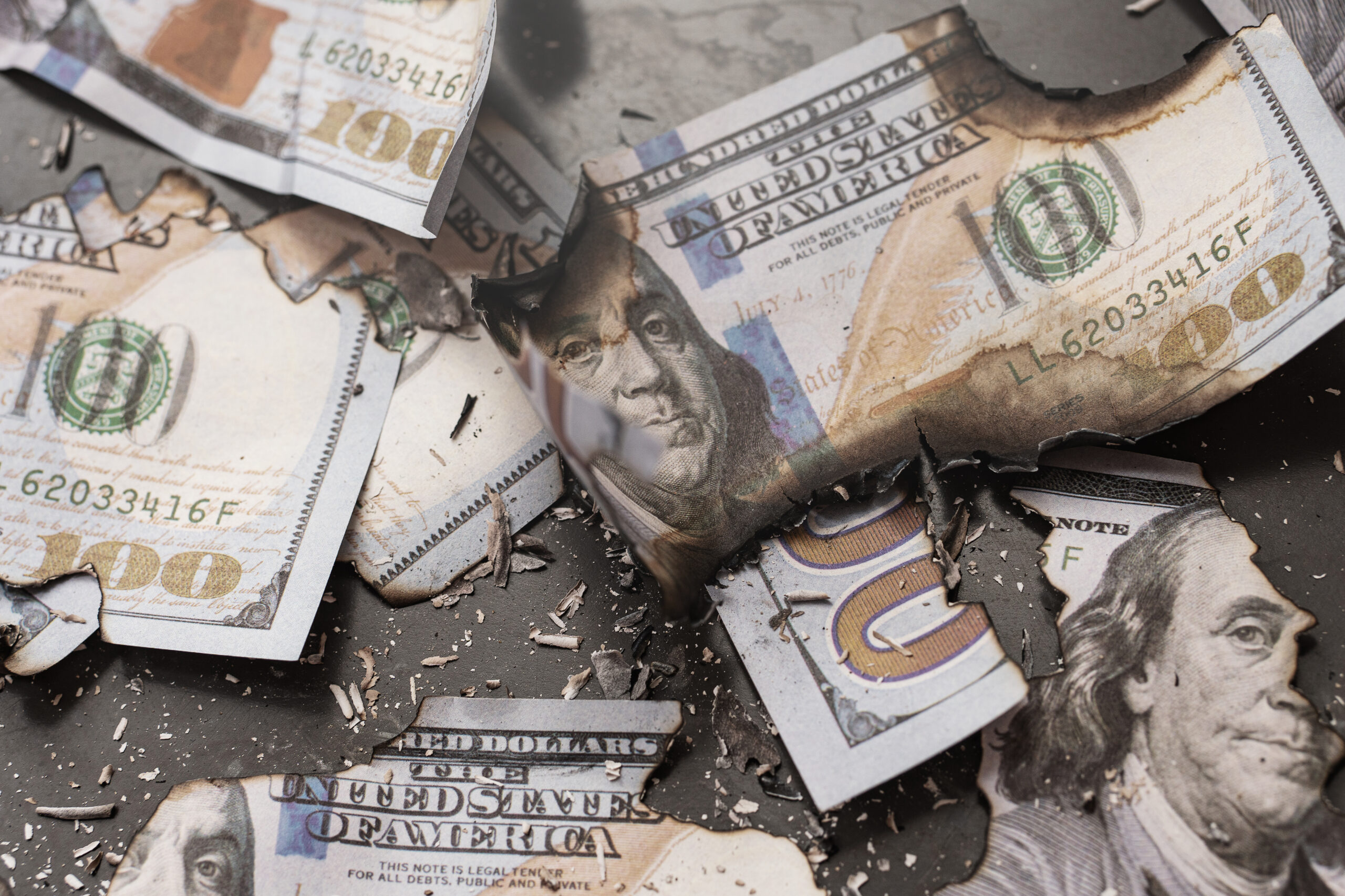 Remains of burnt one hundred dollar bills reduced to ashes